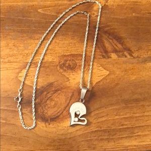 Silver necklace with ‘I love you’ charm.